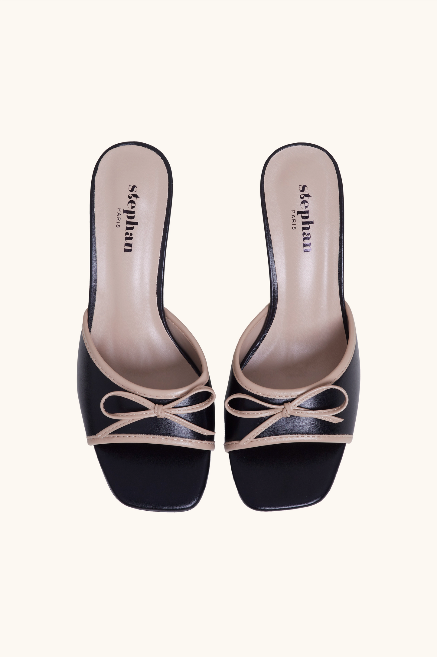 Mules bicolore à détail nœud noir