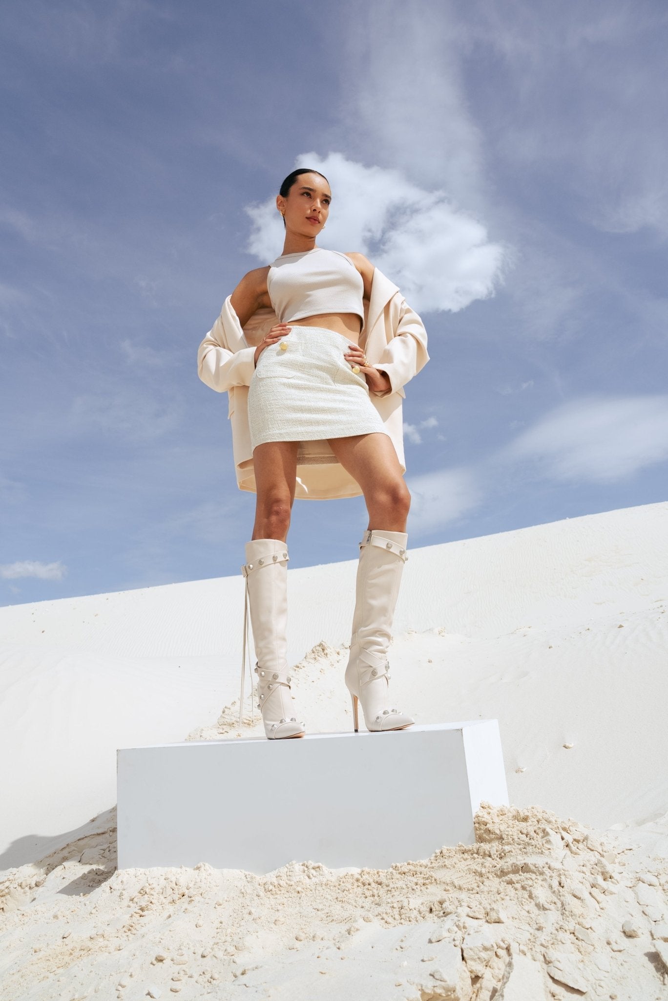 Boots decorated with beige nails