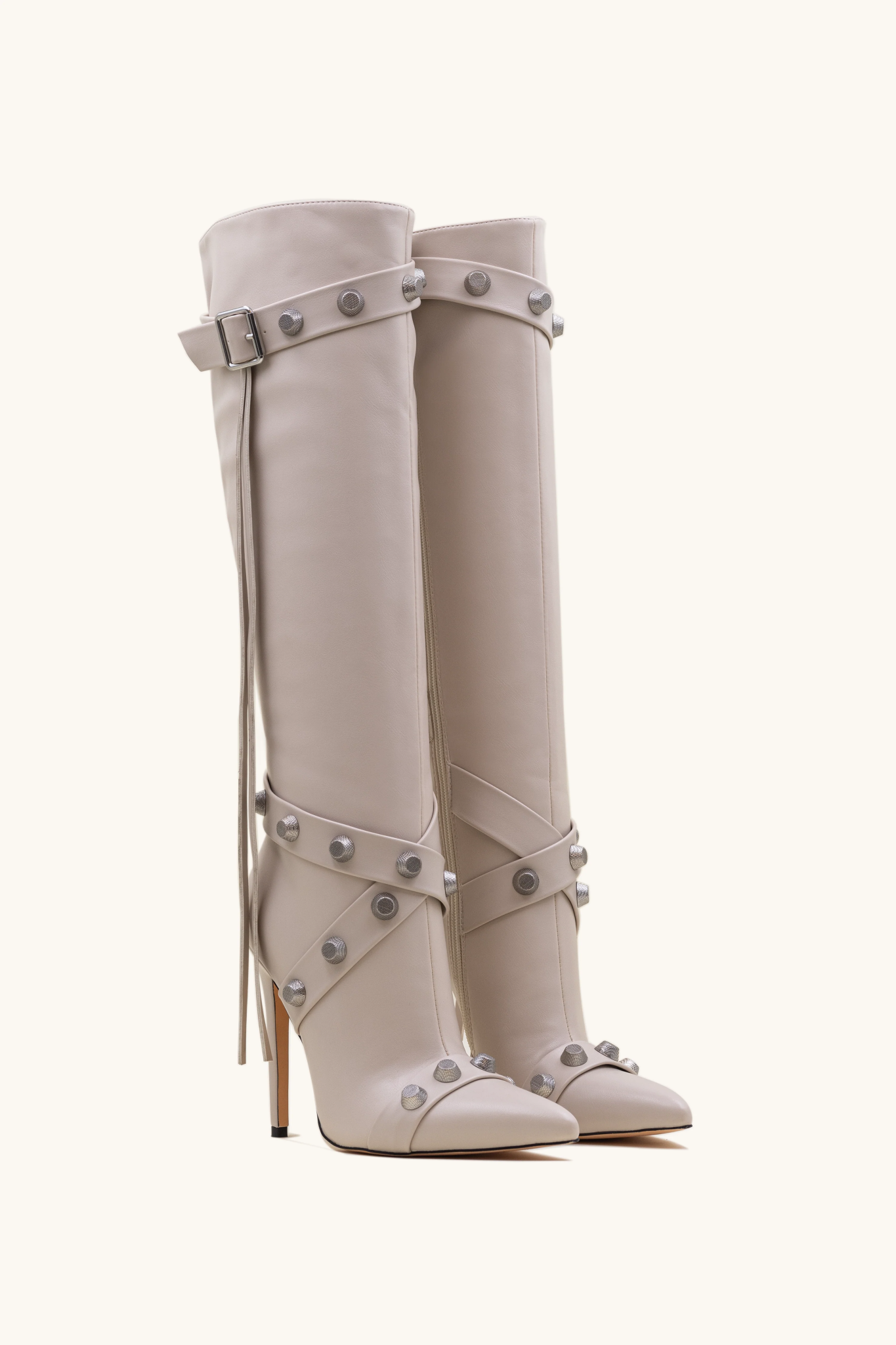 Boots decorated with beige nails
